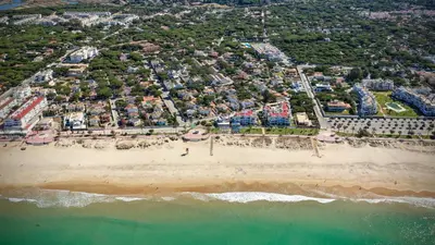 an aerial view of a beach and the ocean at El Campanario in Chiclana de la Frontera