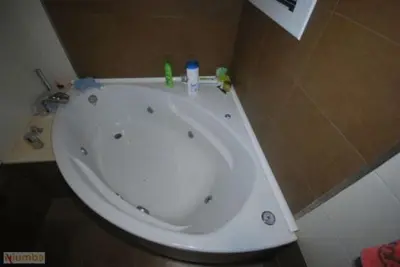 a white bath tub in a bathroom at Casa Paco in Chiclana de la Frontera