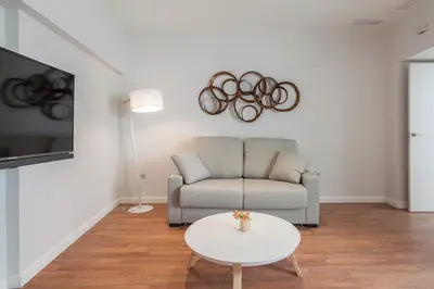 a living room with a couch and a table at Tandem Ancha 34 in Cádiz