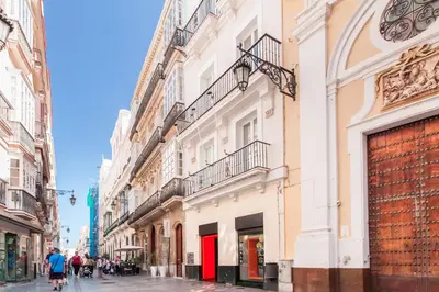 a street in the city with buildings at Tandem Ancha 34 in Cádiz