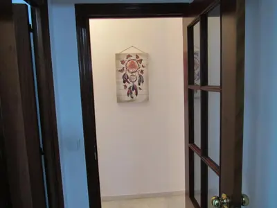a small kitchen with a sink and a refrigerator at Apartamento Alameda in Cádiz