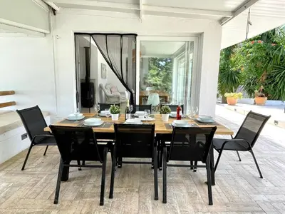 a dining room with a table and chairs at Chalet El Molino in Chiclana de la Frontera