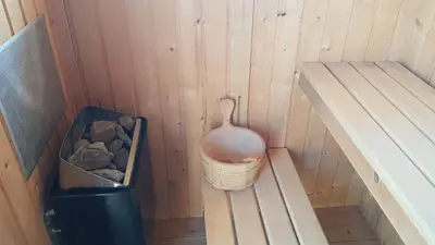 a small bathroom with a toilet and a trash can at El chalet del Mar in Chiclana de la Frontera