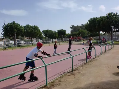 a group of children on roller skates at a park at Villa Valdelagrana fantástica para familias in Cádiz