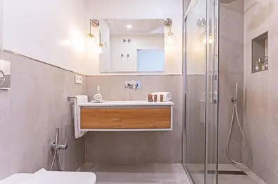 a bathroom with a sink and a shower at Genteel Home Plaza de España Cádiz in Cádiz