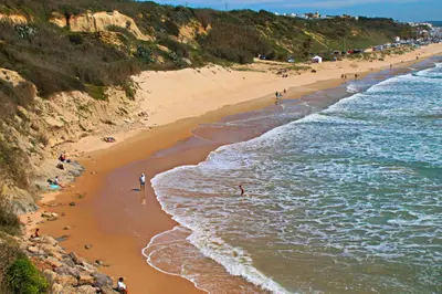 an aerial view of a beach with people on it at Apartamento Chinarejo in Conil de la Frontera