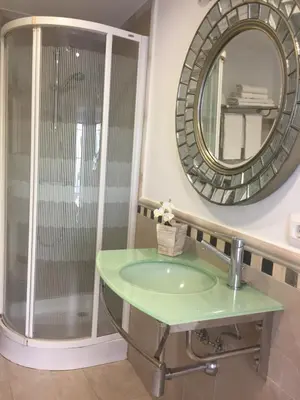 a bathroom with a sink and a mirror at La Casa de Abu - Casita con Encanto in Medina Sidonia
