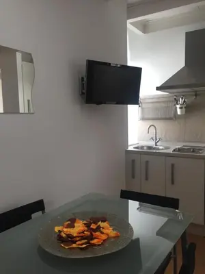 a table in a kitchen with a plate of food on it at La Casa de Abu - Casita con Encanto in Medina Sidonia