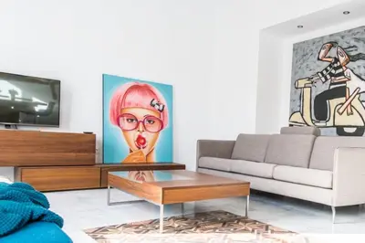 a living room with a couch and a table at Casa Margot Cádiz Grupo AC Gestión in Cádiz