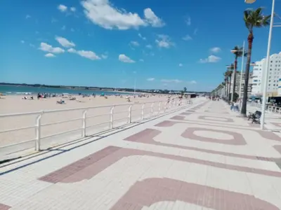 a view of the beach from the boardwalk at Apartamento Valdelagrana in El Puerto de Santa María