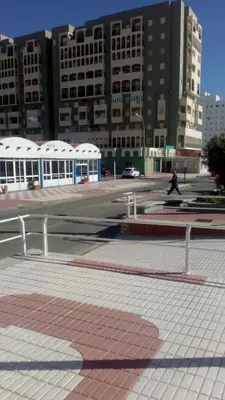 a person riding a skateboard on a city street at Apartamento Valdelagrana in El Puerto de Santa María