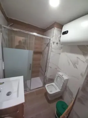 a bathroom with a shower and a toilet and a sink at Apartamento Valdelagrana in El Puerto de Santa María