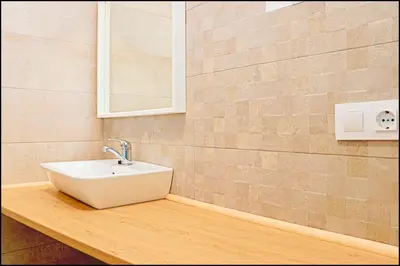 a bathroom with a sink on a wooden counter at Apartamento rural en Conil in Conil de la Frontera