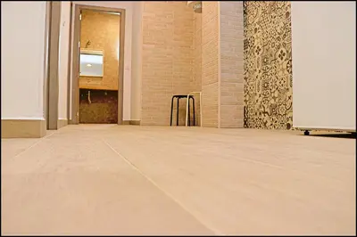 a room with a wooden floor in a building at Apartamento rural en Conil in Conil de la Frontera