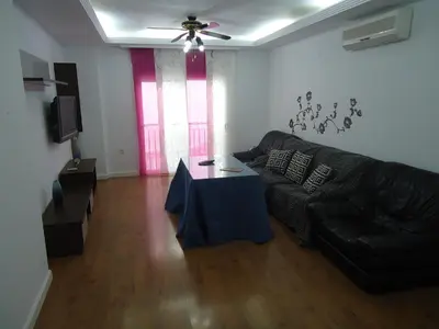 a living room with a couch and a table at Apartamento Thebussem in Medina Sidonia