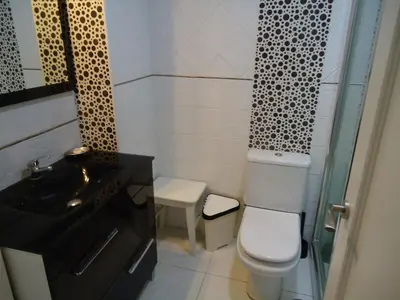 a small bathroom with a toilet and a sink at Apartamento Thebussem in Medina Sidonia