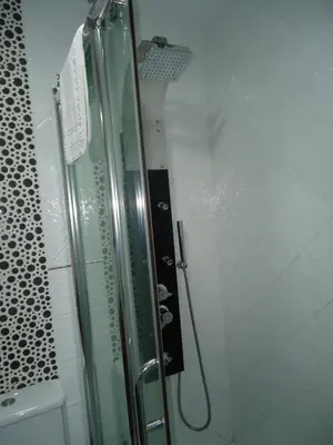a shower with a glass door in a bathroom at Apartamento Thebussem in Medina Sidonia