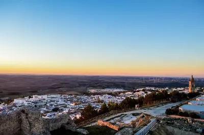 an aerial view of a city at sunset at Apartamento Thebussem in Medina Sidonia