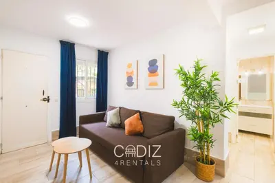 a bedroom with a large white bed in a room at Hospederia IMAR by Cadiz4Rentals in Cádiz