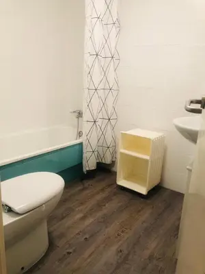 a bathroom with a toilet and a sink and a tub at Apartamento Costa Ballena con WIFI in Rota