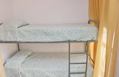 a pair of bunk beds in a room at Apartamento Andujar in Cádiz