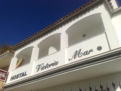 a sign on the side of a building at Hostal Victoria Mar in Chipiona