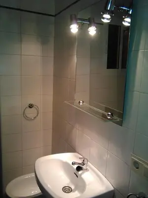 a bathroom with a sink and a mirror at Piso en centro histórico in Jerez de la Frontera