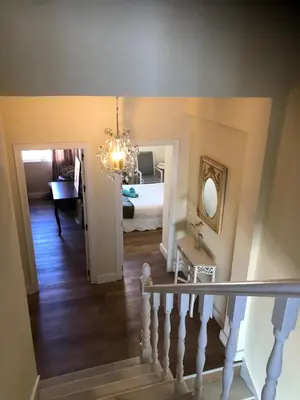 a hallway with a staircase leading to a bedroom at Luxury Oceanfront triplex in Cadiz in Cádiz