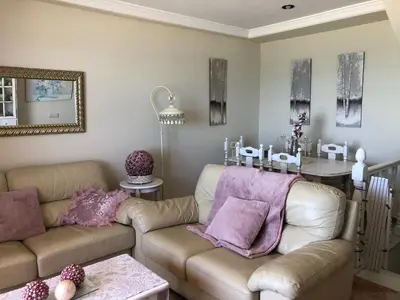 a living room with a couch and a table at Luxury Oceanfront triplex in Cadiz in Cádiz