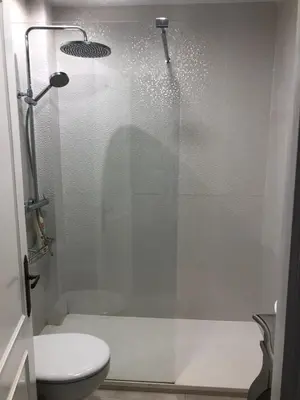 a bathroom with a glass shower with a toilet at Luxury Oceanfront triplex in Cadiz in Cádiz