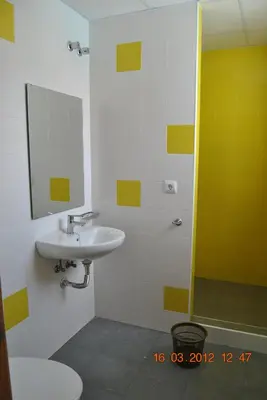 a bathroom with a sink and a shower at Albergue Inturjoven Jerez De La Frontera in Jerez de la Frontera