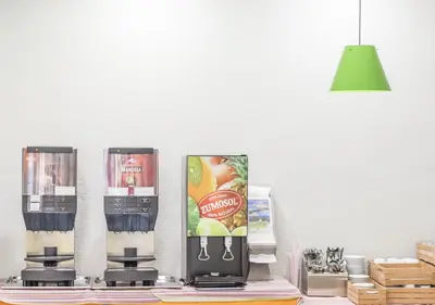 a counter with two coffee machines on a table at Albergue Inturjoven Chipiona in Chipiona