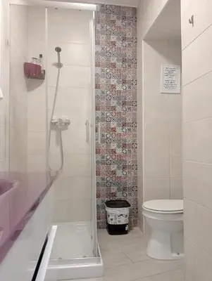a bathroom with a shower with a toilet and a sink at La Caleta de Cadiz WiFi in Cádiz