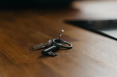 a pair of keys sitting on a wooden table at Casa Palacio -Sanlúcar- in Sanlúcar de Barrameda