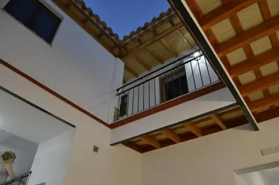 a room with a balcony in a house at Casa Rural Pueblos Blancos in Bornos
