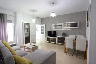 a living room with a couch and a table at Apartamento Duque de Arcos 2 in Arcos de la Frontera
