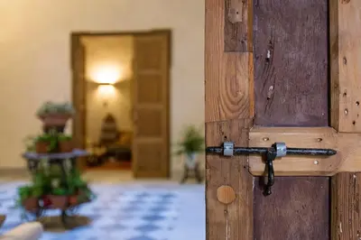 an open wooden door with a handle in a room at Hotel Casa de las Cuatro Torres in Cádiz