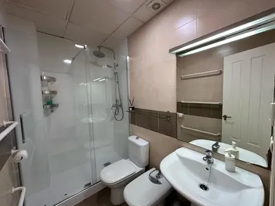 a bathroom with a toilet and a sink and a shower at El Atico de los INGLESES by Cadiz4Rentals in Cádiz