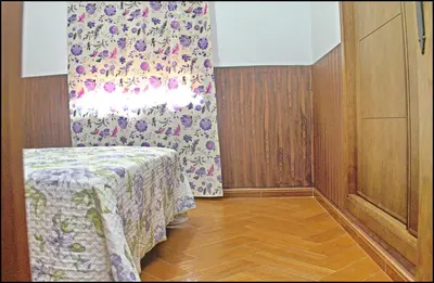 a room with a table with a flowered curtain in it at Casa Maestro Roche in Roche