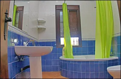a bathroom with a sink and a mirror at Casa Maestro Roche in Roche