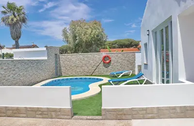 a villa with a swimming pool in a yard at Chalet Veron in Conil de la Frontera