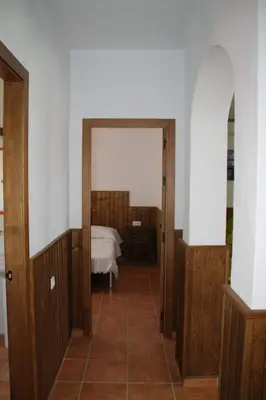 a hallway with a room with a bed in it at Chalet Cala de Roche in Roche