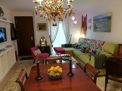 a living room with a couch and a table at Rota playa Calle Puyana in Rota