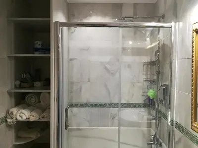 a shower with a glass door in a bathroom at Rota playa Calle Puyana in Rota