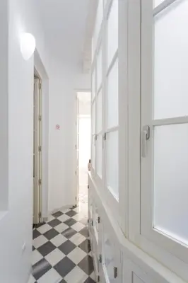 a hallway with a black and white checkered floor at La PEPA1812 by Cadiz4Rentals in Cádiz