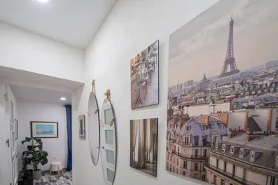 a hallway with pictures on the walls of a room at Apartamento Arco de los Blanco in Cádiz