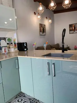 a kitchen with a sink and a counter top at Alojamientos Rurales Inma in Conil de la Frontera
