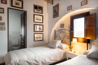 a bedroom with two beds and a window at HACIENDA LAS MESAS - Luxury Villa Jerez in Jerez de la Frontera
