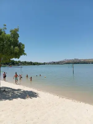 a group of people playing in the water on a beach at Atiko La Vista in Arcos de la Frontera