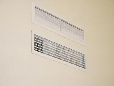 a window with blinds on a white wall at Sherry Loft Siente Jerez Parking Incluido in Jerez de la Frontera
